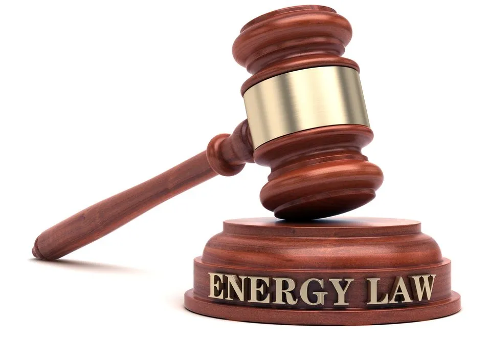 A wooden gavel resting on a base labeled "Energy Law," symbolizing legal matters related to energy.